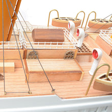 Load image into Gallery viewer, Rest on a solid wood base with metal nameplate.